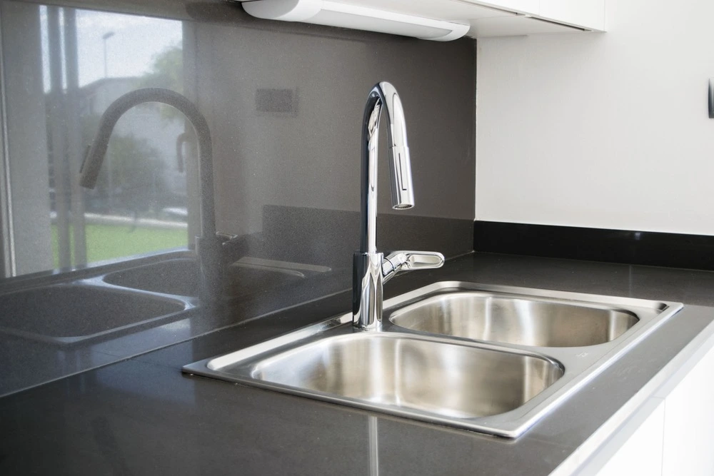 stainless steel double bowl sink in kitchen.